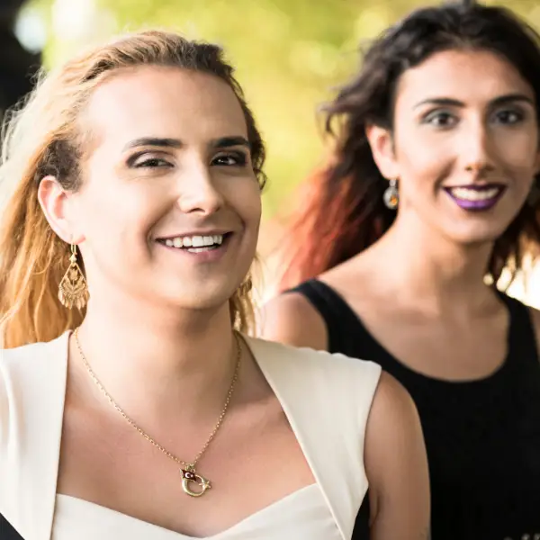Two transgender women smiling outdoors, symbolizing gender-affirming therapy and LGBTQ support in Chicago.